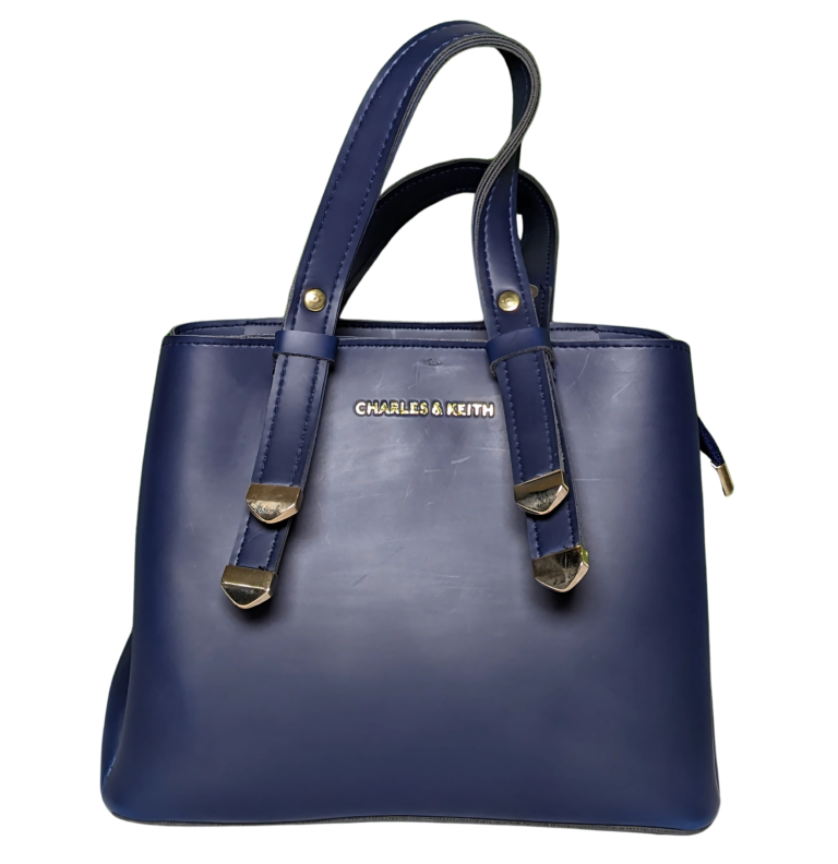 Small Dark Blue Handbag made of PU leather with adjustable strap, zip closure, spacious compartments, and a stylish compact design.